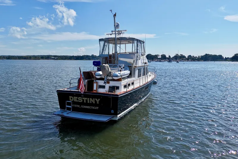 Slide: The Image of Sabreline 47 boat from 1997 named "Destiny" on calm waters, Mystic, Connecticut. - 9
