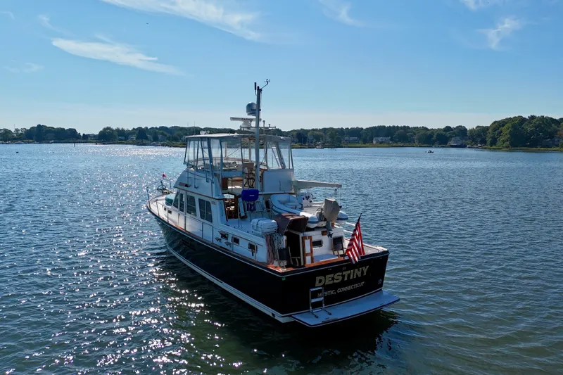 Slide: The Image of 1997 Sabre Sabreline 47 yacht "Destiny" on serene water, sunny day, Mystic, Connecticut. - 10