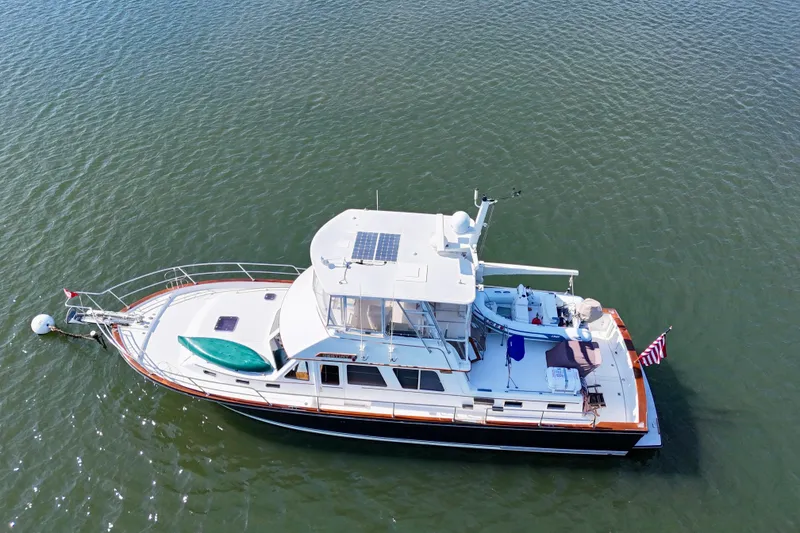 Slide: The Image of Aerial view of 1997 Sabre Sabreline 47 yacht on calm water. - 12