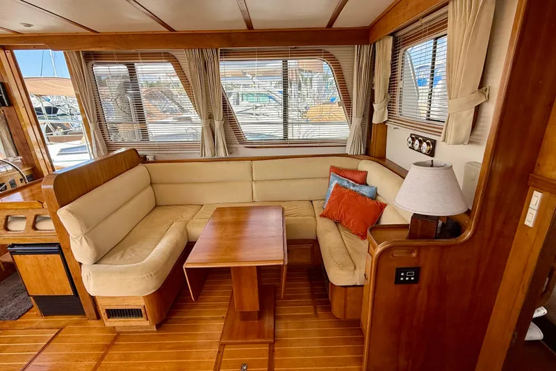 Slide: The Image of Luxurious 1997 Sabreline 47 yacht interior with cozy seating and elegant wood finish. - 59