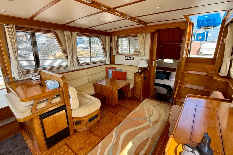 Slide: The Image of Luxurious interior of 1997 Sabreline 47 yacht with wood finishes and cozy seating area. - 61