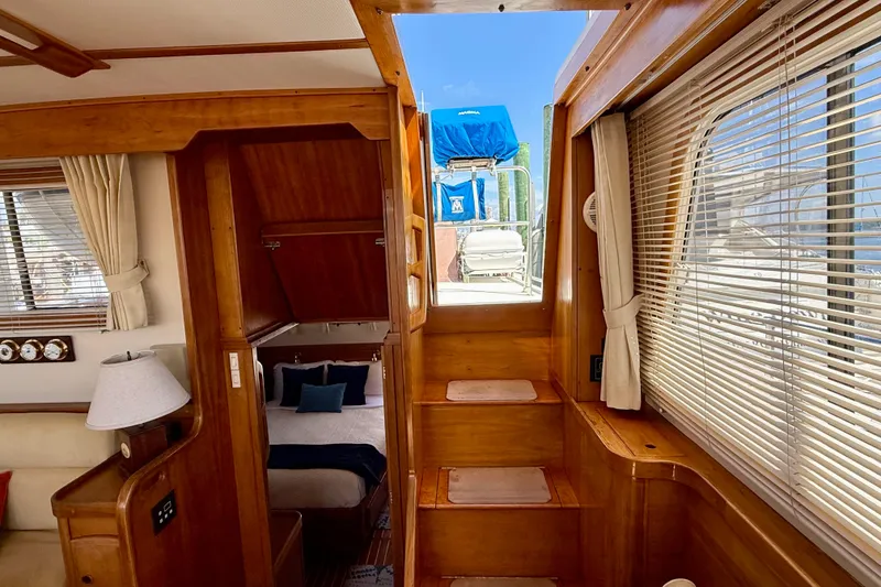 Slide: The Image of Interior of 1997 Sabreline 47 yacht with wooden stairs and cozy cabin. - 63