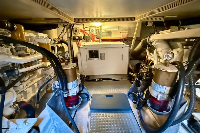Slide: The Image of Engine room of a 1997 Sabre Sabreline 47 yacht, showcasing machinery and equipment. - 71