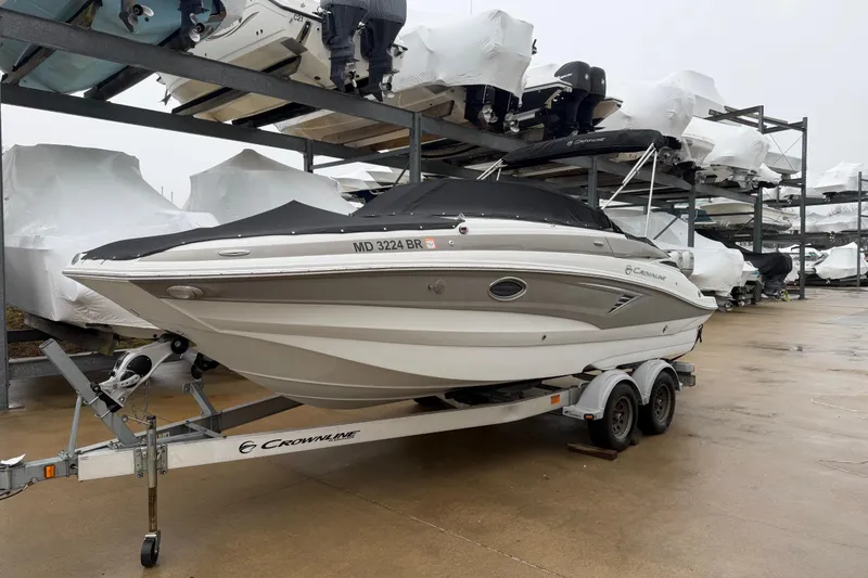 The Image of 2021 Crownline Eclipse E235 XS boat on trailer in storage facility. - 0