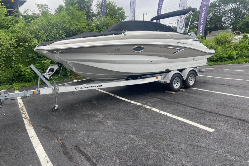 Slide: The Image of 2021 Crownline Eclipse E235 XS boat on trailer in parking lot. - 3