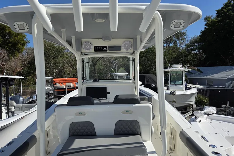 Slide: The Image of 2019 World Cat 295 CC boat interior with seating and navigation equipment. - 10