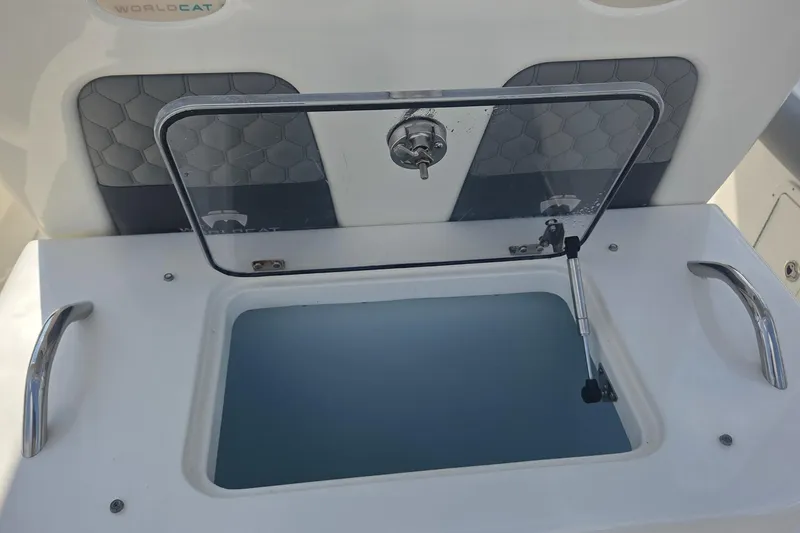 Slide: The Image of Open storage compartment on a 2019 World Cat 295 CC boat. - 11