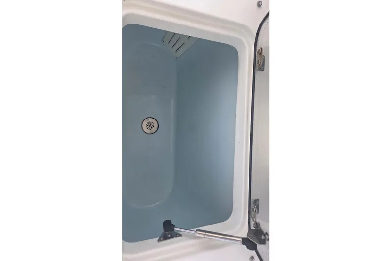 Slide: The Image of Open storage compartment on 2019 World Cat 295 CC boat. - 12