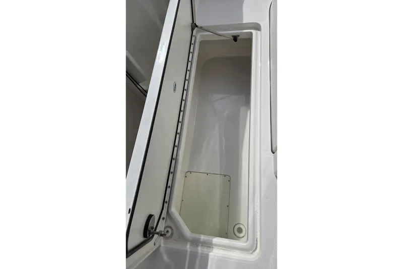 Slide: The Image of Open storage compartment on a 2019 World Cat 295 CC boat. - 19