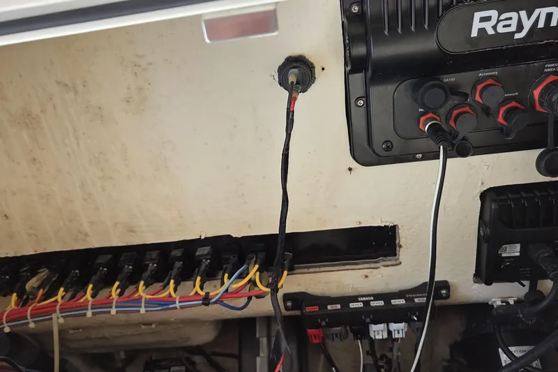 Slide: The Image of Electrical panel and wiring inside a 2019 World Cat 295 CC boat. - 27