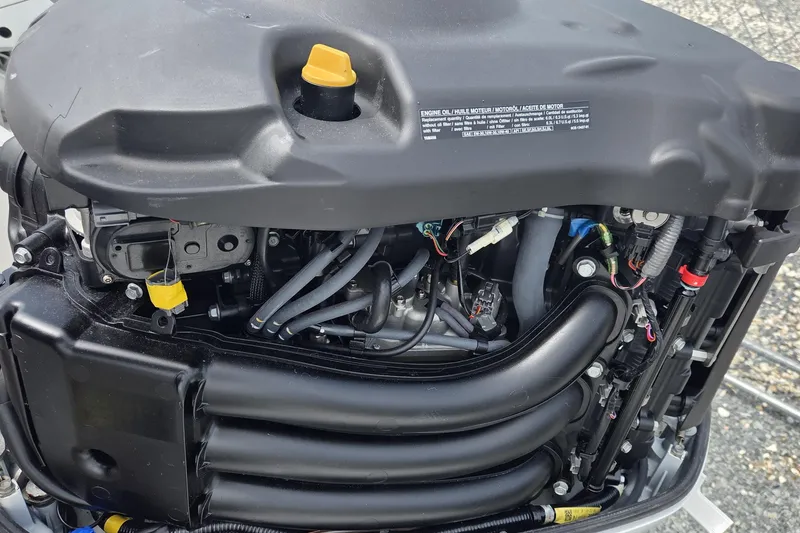 Slide: The Image of Engine of 2019 World Cat 295 CC boat, showcasing intricate components and wiring. - 30