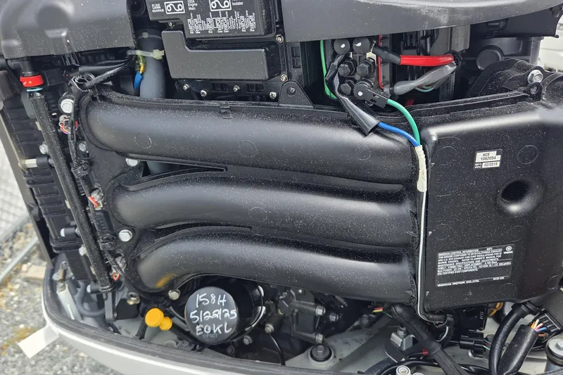 Slide: The Image of Close-up of a 2019 World Cat 295 CC boat engine components. - 33