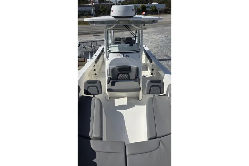 Slide: The Image of 2019 World Cat 295 CC boat interior with seating and console view. - 5