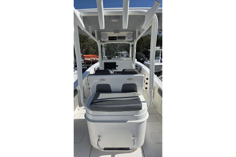 Slide: The Image of 2019 World Cat 295 CC boat interior with seating and console, showcasing modern design. - 7