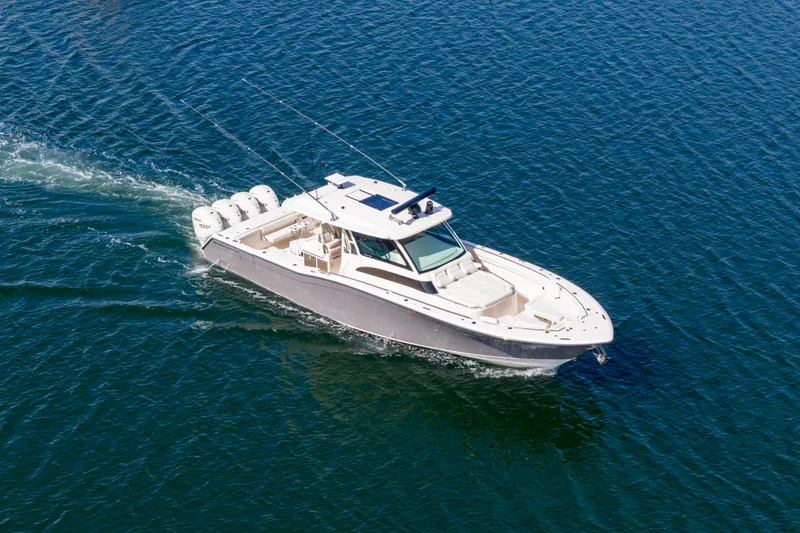 Slide: The Image of 2025 Grady-White Canyon 456 boat cruising on open water. - 15