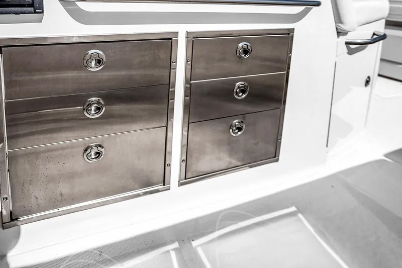 Slide: The Image of Stainless steel storage drawers on 2025 Grady-White Canyon 456 boat. - 26