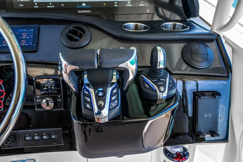 Slide: The Image of Control panel of 2025 Grady-White Canyon 456 boat with advanced navigation systems. - 28