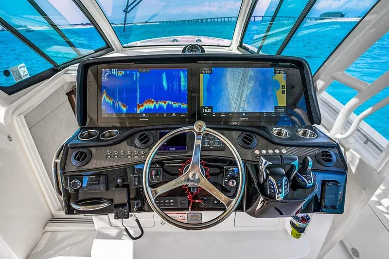 Slide: The Image of Helm of 2025 Grady-White Canyon 456 with advanced navigation displays and controls. - 30