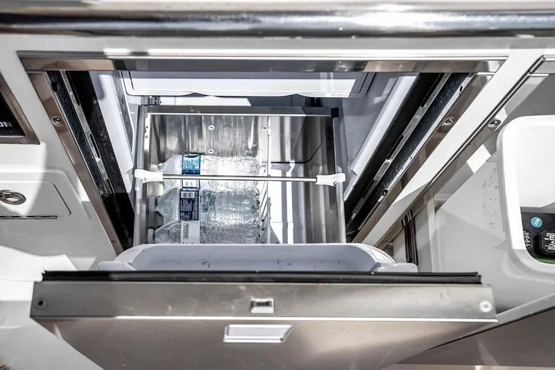 Slide: The Image of Built-in cooler with water bottles on Grady-White Canyon 456, 2025 model. - 36