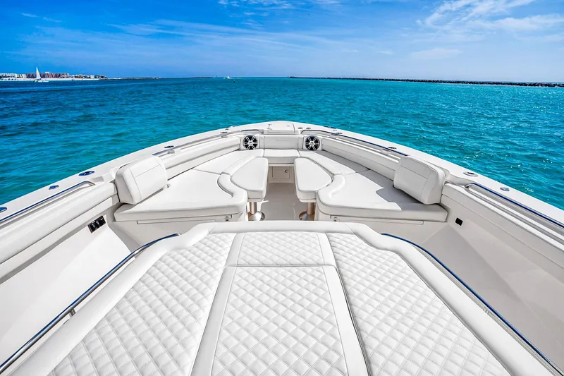 Slide: The Image of Luxurious 2025 Grady-White Canyon 456 boat interior with plush seating on open water. - 39