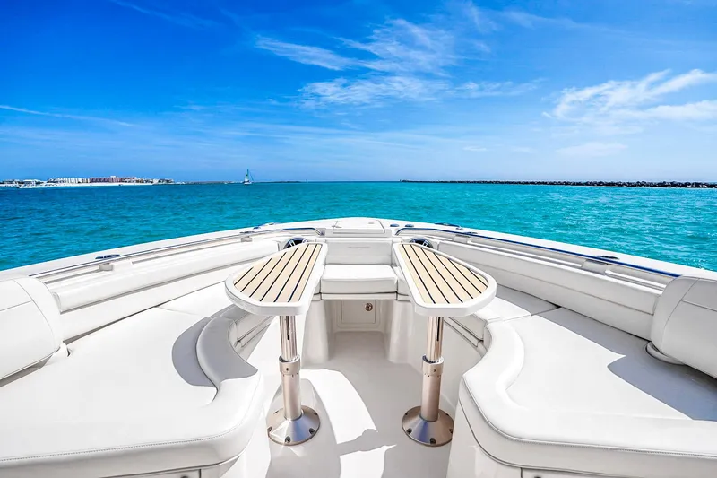 Slide: The Image of 2025 Grady-White Canyon 456 boat interior with ocean view and clear blue sky. - 40