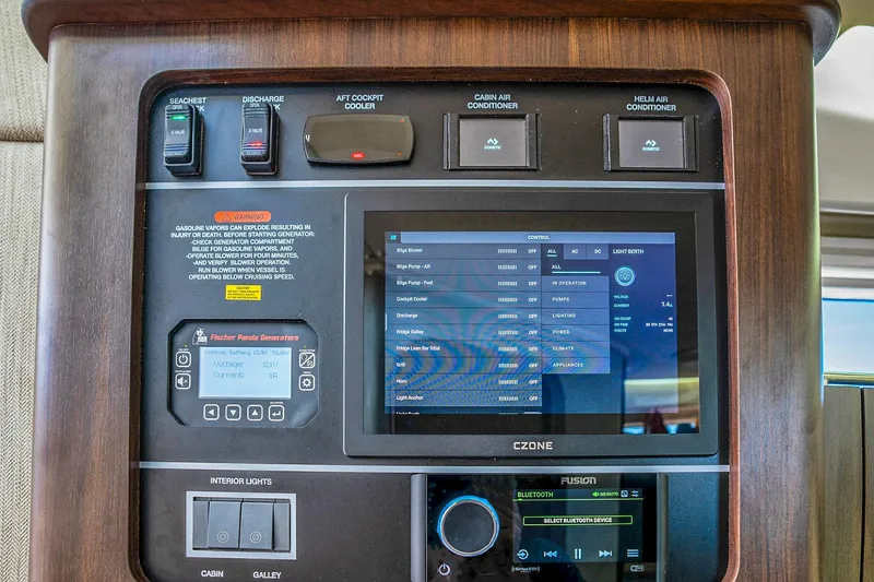 Slide: The Image of Control panel of 2025 Grady-White Canyon 456 boat with digital display and switches. - 50