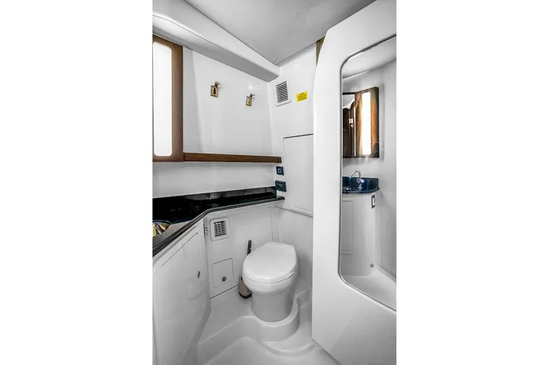 Slide: The Image of Luxurious bathroom in 2025 Grady-White Canyon 456 boat, featuring modern fixtures and sleek design. - 51