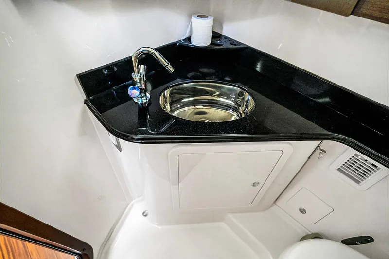 Slide: The Image of Luxury bathroom sink in 2025 Grady-White Canyon 456 boat, featuring sleek design and modern fixtures. - 53