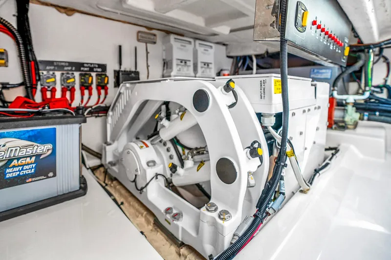 Slide: The Image of Engine compartment of 2025 Grady-White Canyon 456 boat, featuring advanced electrical systems. - 63