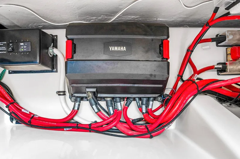 Slide: The Image of Yamaha electrical system in 2025 Grady-White Canyon 456 boat, featuring red cables. - 66