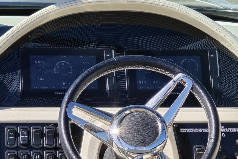 Slide: The Image of Dashboard of 2021 Regal 2800 Bowrider with steering wheel and digital displays. - 11