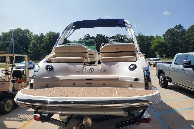 Slide: The Image of 2021 Regal 2800 Bowrider boat on trailer, rear view, sunny day. - 8