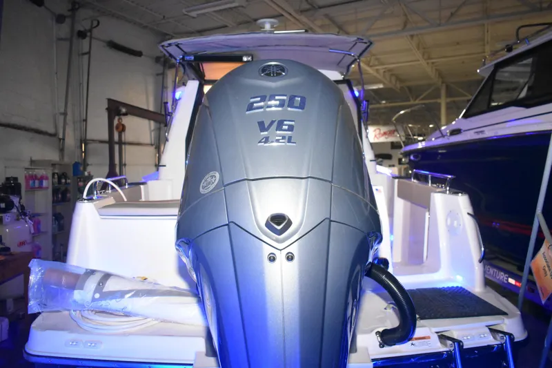Slide: The Image of 2026 Cutwater C-248 Coupe with Yamaha 250 V6 engine in a showroom. - 11