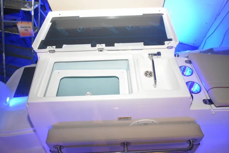 Slide: The Image of 2026 Cutwater C-248 Coupe boat interior with open storage compartment and sink. - 15