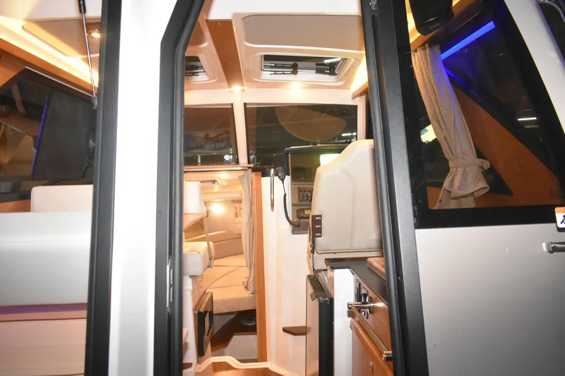 Slide: The Image of Interior view of 2026 Cutwater C-248 Coupe, showcasing modern design and cozy seating. - 17
