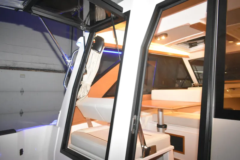 Slide: The Image of 2026 Cutwater C-248 Coupe interior with modern seating and ambient lighting. - 20