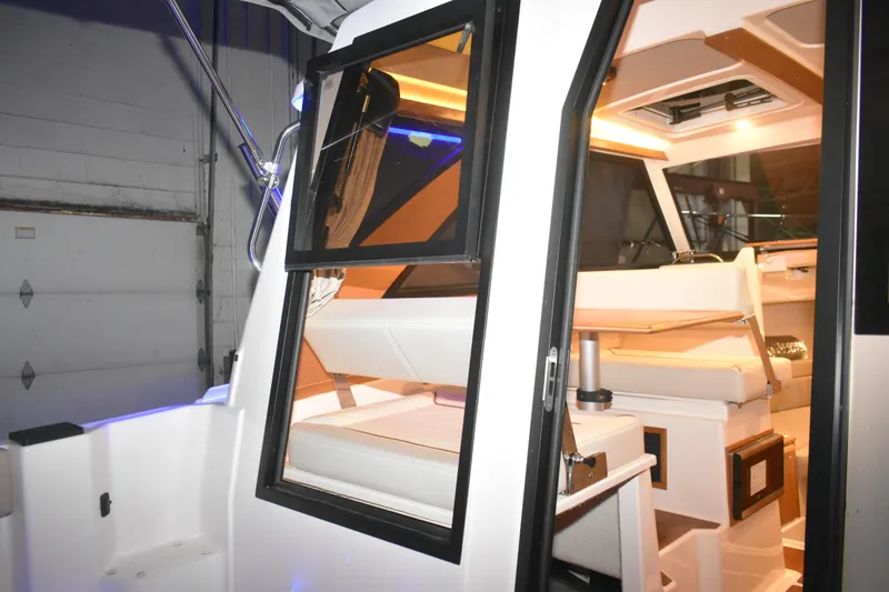 Slide: The Image of 2026 Cutwater C-248 Coupe interior view with modern seating and lighting. - 21