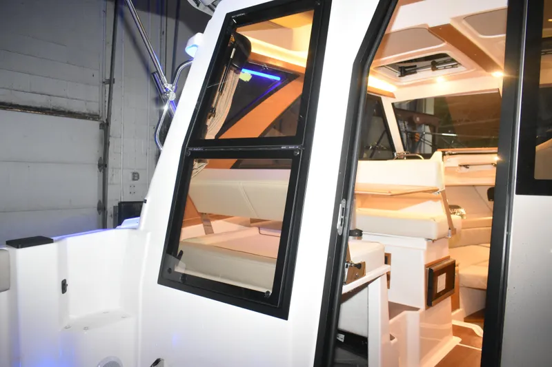 Slide: The Image of Interior view of 2026 Cutwater C-248 Coupe boat, showcasing seating and cabin design. - 22