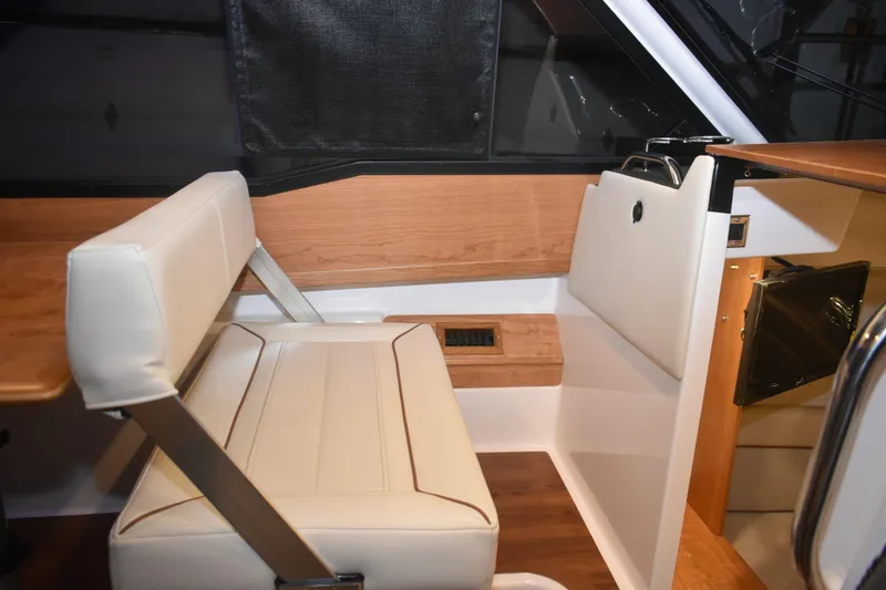 Slide: The Image of Interior of 2026 Cutwater C-248 Coupe featuring elegant seating and wood accents. - 32