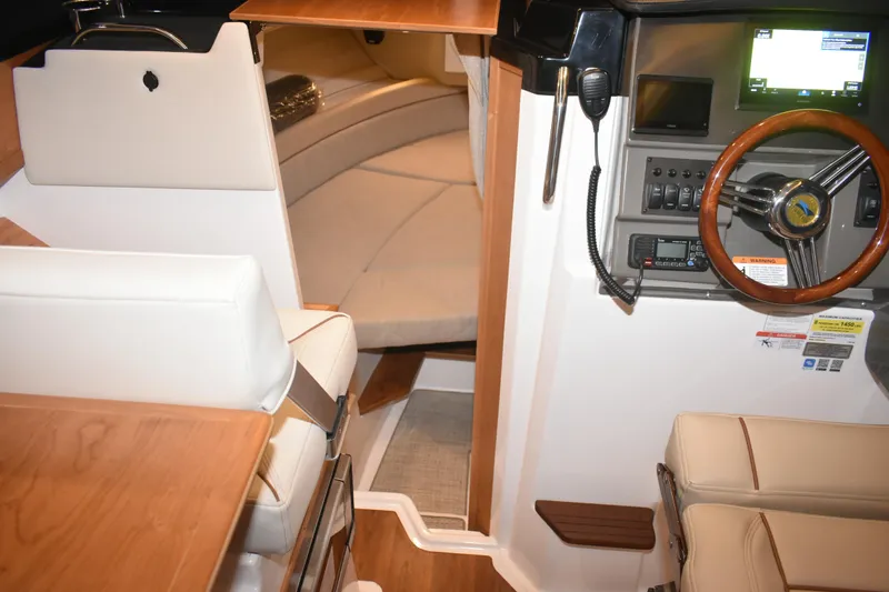 Slide: The Image of Interior of 2026 Cutwater C-248 Coupe, featuring helm and seating area. - 39