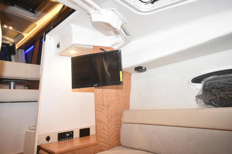 Slide: The Image of 2026 Cutwater C-248 Coupe interior with TV, modern lighting, and comfortable seating. - 41