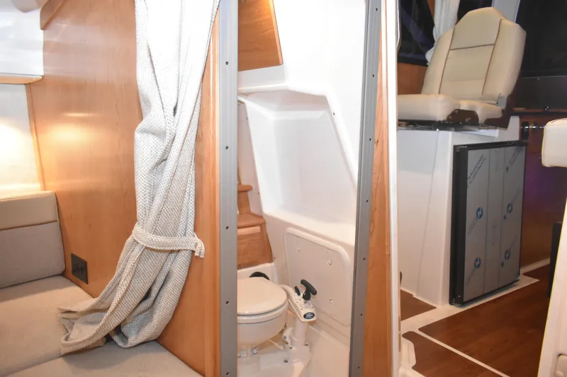 Slide: The Image of 2026 Cutwater C-248 Coupe interior with compact bathroom and seating area. - 42