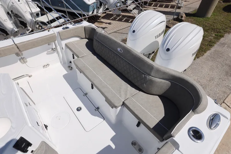 Slide: The Image of 2026 Sea Hunt Ultra 275 Coffin Box boat with spacious seating and dual Yamaha engines. - 12