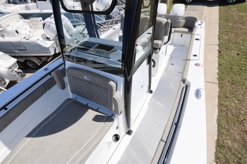 Slide: The Image of 2026 Sea Hunt Ultra 275 Coffin Box boat interior with seating and console. - 14