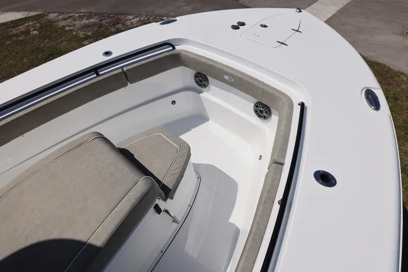Slide: The Image of 2026 Sea Hunt Ultra 275 Coffin Box boat interior with cushioned seating and speakers. - 15