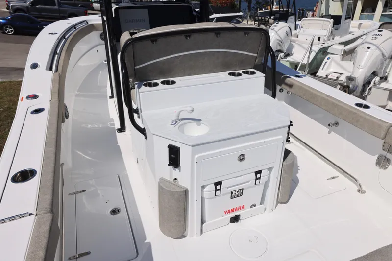 Slide: The Image of 2026 Sea Hunt Ultra 275 Coffin Box boat interior with seating and storage. - 2