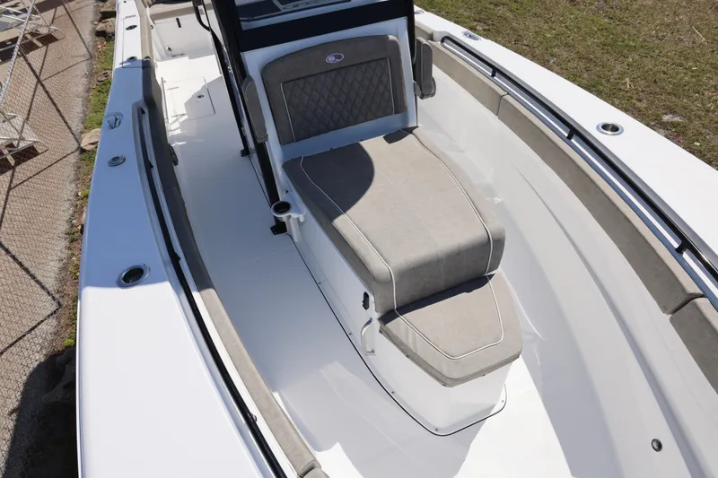 Slide: The Image of 2026 Sea Hunt Ultra 275 Coffin Box boat interior with cushioned seating and sleek design. - 3
