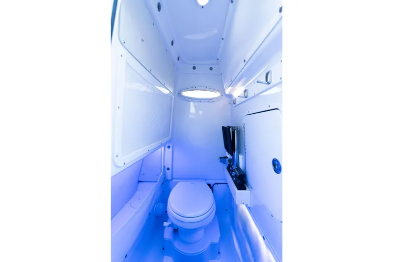 Slide: The Image of Interior of 2026 Sea Hunt Ultra 275 Coffin Box boat bathroom, featuring modern amenities. - 38