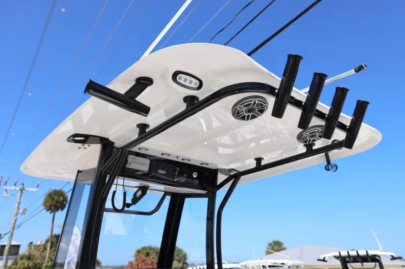 Slide: The Image of T-top of 2026 Sea Hunt Ultra 275 Coffin Box boat with rod holders and speakers. - 6
