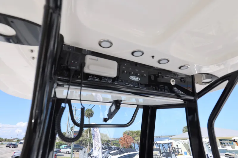 Slide: The Image of 2026 Sea Hunt Ultra 275 Coffin Box boat interior with electronic equipment and lighting. - 7